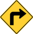 This yellow diamond-shaped sign with black symbols cautions that there is: